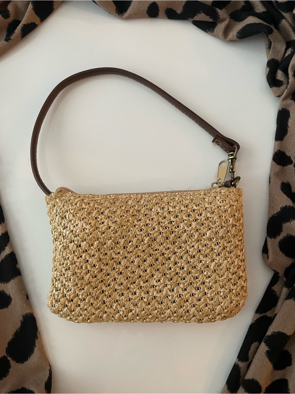 Tan woven handbag with brown strap